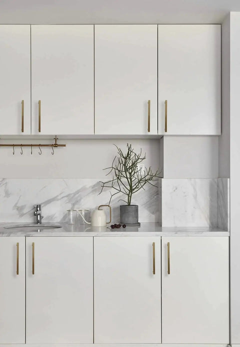 Modern kitchen with white cabinets featuring 10 Pack 8 Inch Hole Center Champagne Cabinet Pulls In Stainless Steel Square Drawer Handles.
