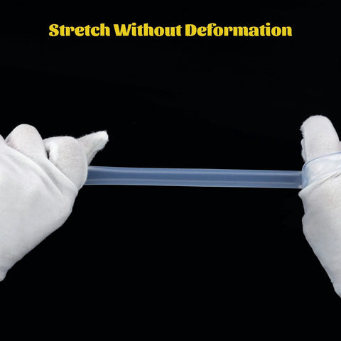 Clear silicone tubing, 1/4 in ID × 3/8 in OD, food-grade, held taut by gloved hands against a black background