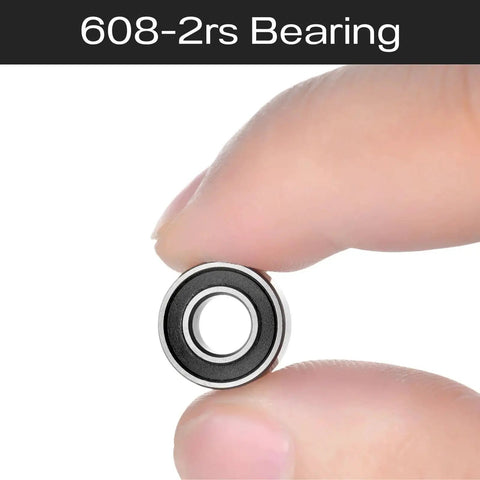 Close-up of 608 2RS Double Rubber Sealed Ball Bearing held between fingers, 8x22x7mm size for 3D printers, skateboards, and motors.