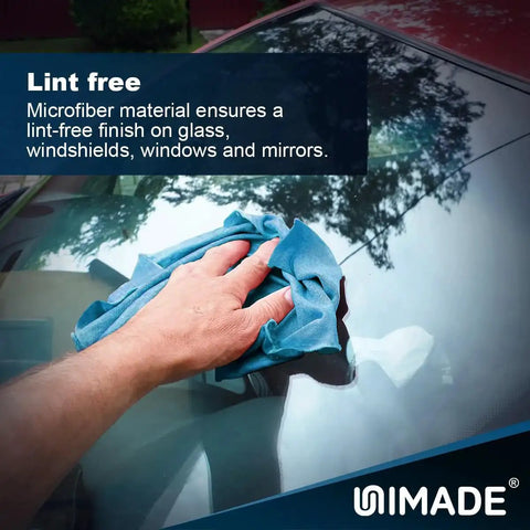Hand using Microfiber Shop Towels 100 Sheets Dispenser Pack Lint Free For Auto Garage Blue on car windshield