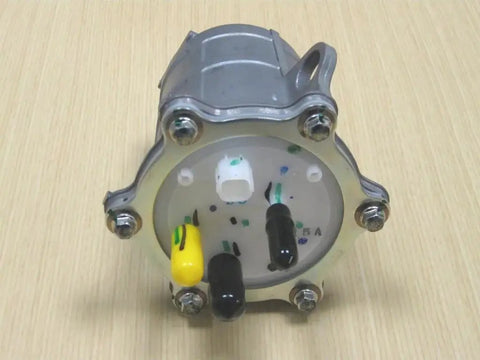 Close-up of TRX 420 Rancher ATV Fuel Pump Assembly OEM Replacement For 2007 Through 2013 Models on wooden surface