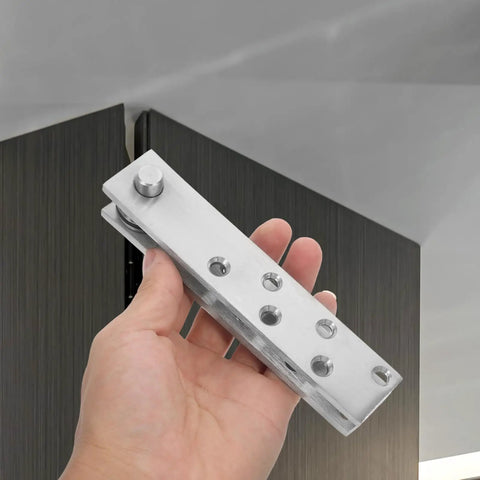 Hand holding 360 Degree Hidden Door Pivot Hinge System For Bookcases And Secret Doors Heavy Duty Stainless Steel Concealed Hinges