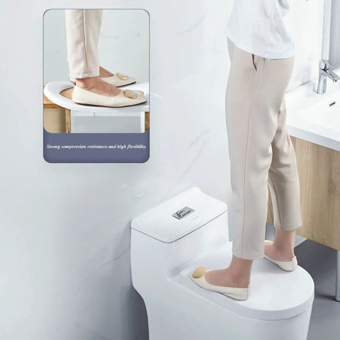 Person standing on Elongated Toilet Seat With Quiet Close, Grip Tight Bumpers, Easy To Install And Clean, White Comfort Seat For Heavy Duty Use, Strong Bearing Capacity, Anti Slip, Durable Construction For Quiet Nighttime Use.