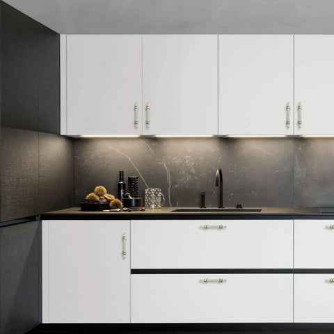Stylish kitchen with 10 Pack 3 Inch Cabinet Handles in Brushed Nickel and Gold Finish on white cabinets, enhancing modern decor.