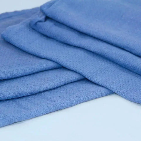 Blue folded towels from Pro Grade Reclaimed Huck Towels Box With 25 Lb Contents, About 225 Recycled Rags, 100 Percent Cotton