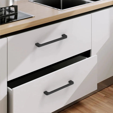 10 Pack 5 Inch Matte Black Cabinet Pulls Zinc Alloy Kitchen Cabinet Handles installed on white kitchen drawers, 128mm center to center.
