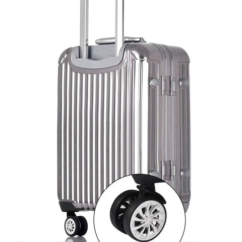 Swivel Replacement Luggage Wheel Set Two Pack 2.2 Inch Heavy Duty on silver suitcase, close-up