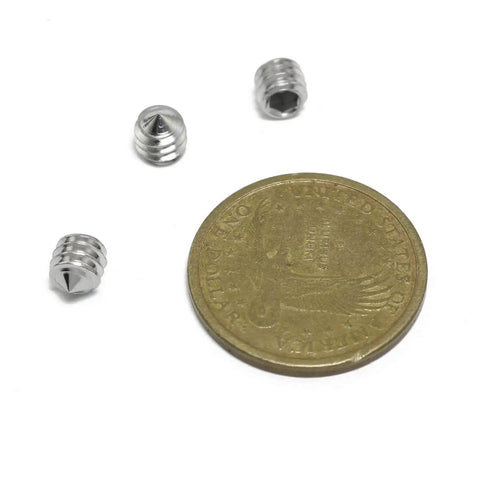 Three Sturdy 25 Pack 1/4-20 Hex Socket Grub Screws Set In 304 Stainless Steel with a coin for scale.