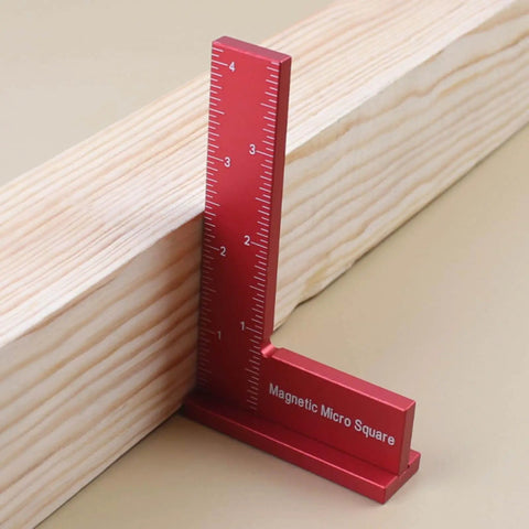 Red Magnetic Machinist Square With Dual Rare Earth Magnets For Hands Free Precision in use on wooden plank