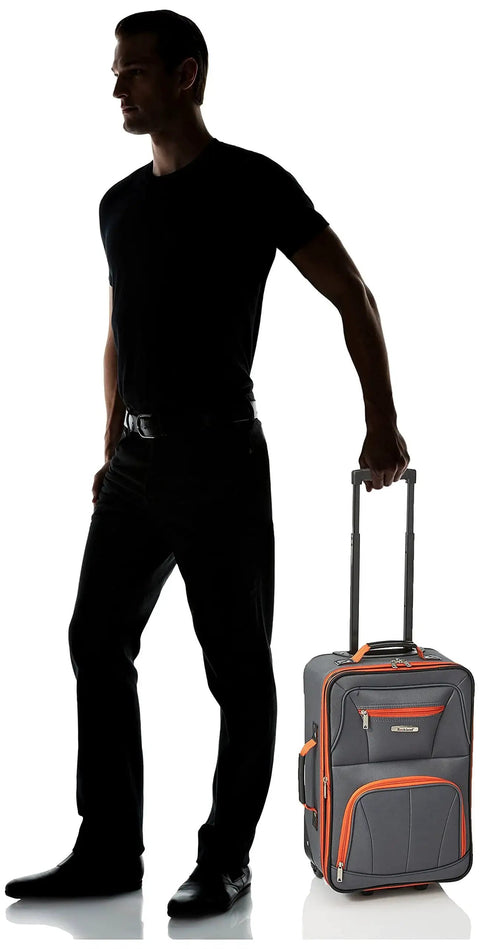 Man with Expandable Softside Upright Luggage Set In Charcoal, 20 inch upright with inline skate wheels, by Rockland