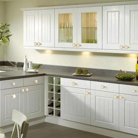 White kitchen cabinets with Four Leaf Clover Cabinet Knob Set 15 Pcs Zinc Alloy Pulls Gold Finish Clover Handles installed.