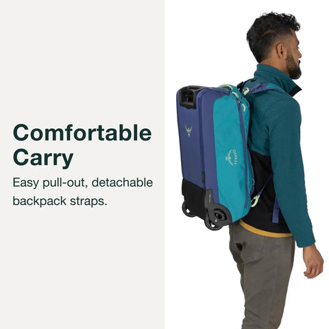 Person carrying Daylite 40L Wheeled Carry On Collapsible Duffel Bag With Backpack Carry In Black showing backpack straps and wheels.