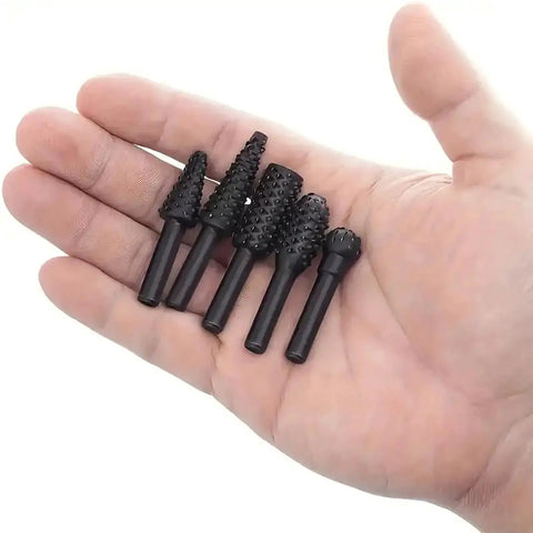 Five Piece Rotary Burr Set For Woodworking Metal Carving And Polishing With One Quarter Inch Shank in hand