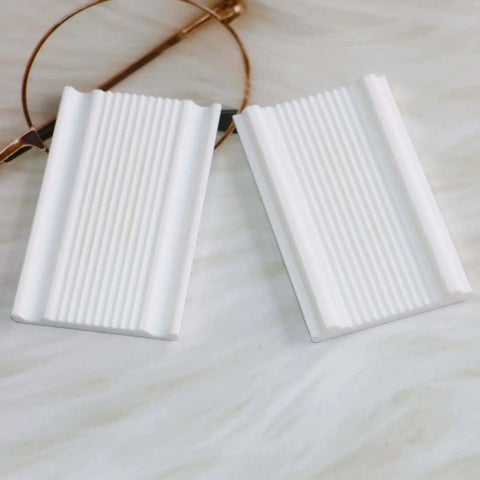 2mm Polymer Clay Micro Bead Roller Tool For Tiny Round Beads, white finish, showing two textured white bead rollers on marble surface