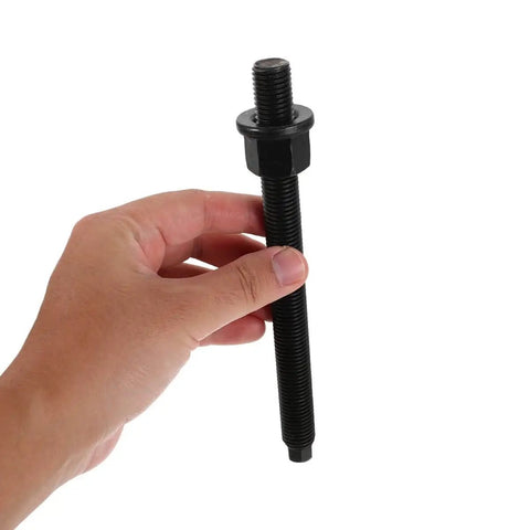 Hand holding a black bolt from Crankshaft Pulley Removal Tool Kit For Engine Maintenance And Auto Repair, Heavy Duty Gear Hub Bearing Puller Set