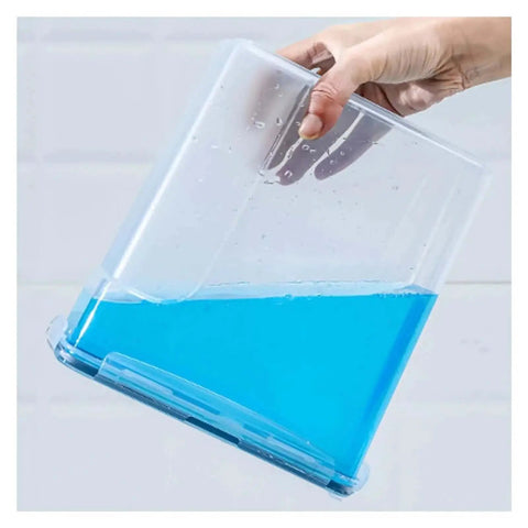 Person holding clear box with blue liquid showing waterproof exterior of Filament Dryer Box For 1Kg Spools Keeps Filament Dry And Ready, Prevents Brittle Printing, Waterproof Exterior, Sealed Moisture Barrier, Perfect For PLA And Other Filaments, White Kitchen Style Storage Case.