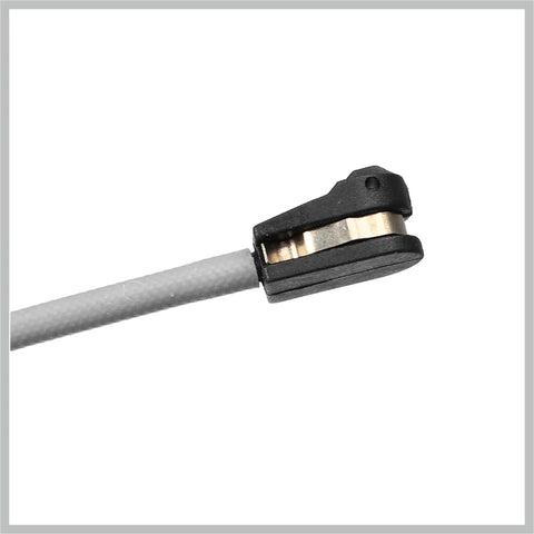 Brake pad wear sensor with black clip on gray lead and copper contact.