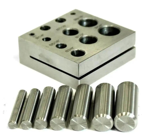 Heavy Duty Disc Cutter With Seven Jewelry Punches From One Quarter Inch To Five Eighths Inch shown on metal blocks