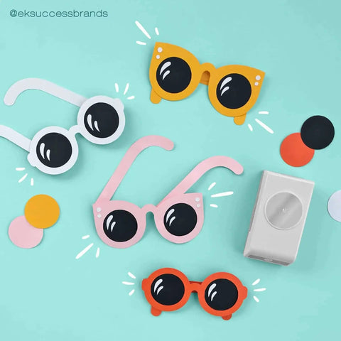 Circle Punch 1.75 Inch With Safety Lock For Clean Crisp Circles In Cardstock on blue background with paper sunglasses