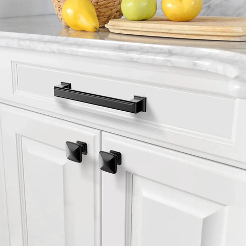 Matte Black 5 Inch Cabinet Pulls 10 Pack With 128mm Hole Centers installed on white kitchen cabinet