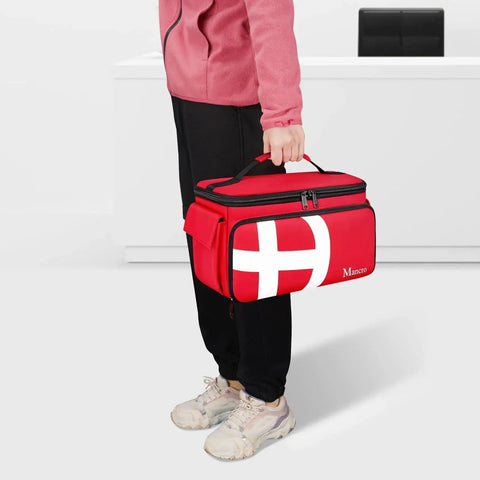 Person holding a red Large Capacity Medical Travel Bag With 12 Pockets And Pill Bottle Organizer for easy organization on the go.