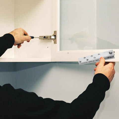 Installation of invisible concealed door hinge with 360 degree pivot for secret bookcase doors, showing hardware.