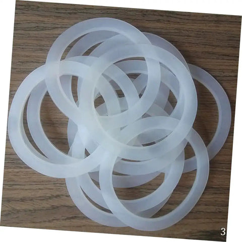 5 Pack Silicone Sealing Rings Replacement Gaskets For Coffee Pot Lids Espresso Pots And Canning Jars on wood surface