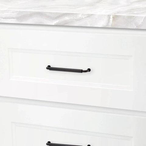 Hollywood Hills 4486 Cabinet Pull 6 Inch Center To Center Solid Brass Hardware installed on a white kitchen drawer.