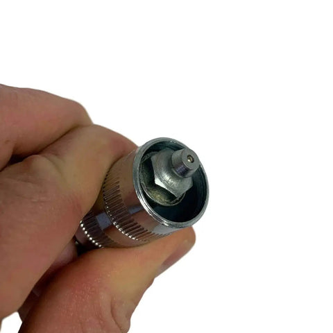 Close-up view of 90 Degree Grease Coupler Adapter For Tight Spaces With Spring Loaded Collar And Three Hardened Steel Jaws Rubber Seal And Check Valve Delivering A Tight Reliable Connection In Hard To Reach Fittings From LockNLube