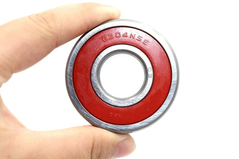 Close-up of Two 6304-2NSE Chrome Steel Deep Groove Ball Bearing, showing red seal
