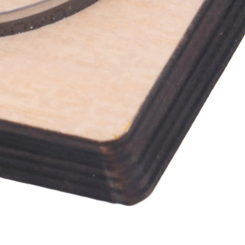 Close-up of 65mm Circular Cutting Die For Leather Cardboard Rubber Plastic Clay And Layered Fabric on birch wood base