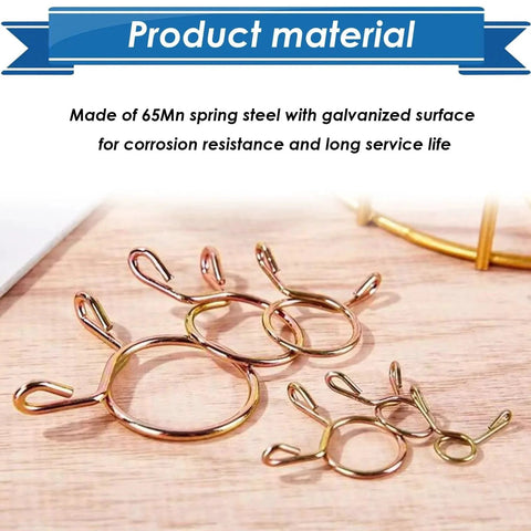Close-up of 330Pcs Nine Size Spring Hose Clamps Set 5mm To 13mm Galvanized 65Mn Spring Clips on wooden surface