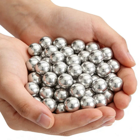 .68 Caliber Aluminum Solid Paintballs 50 x .68 Caliber Self-Defense Balls Compatible, held in hands showcasing shiny finish