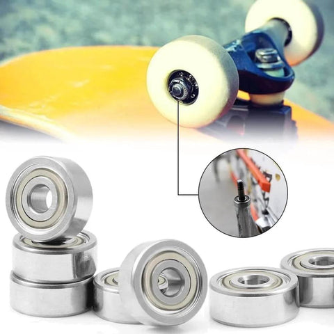 30Pcs 693ZZ Ball Bearings, High Speed Silent Small Bearing Deep Groove Double Shield Bearing Miniature Carbon Steel Bearings (3mm x 8mm x 4 mm) next to skateboard wheel.