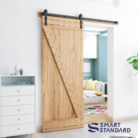 Wooden door with 6ft Barn Door Hardware Kit with I shape hanger, installed in living room, carbon steel track for smooth quiet sliding.