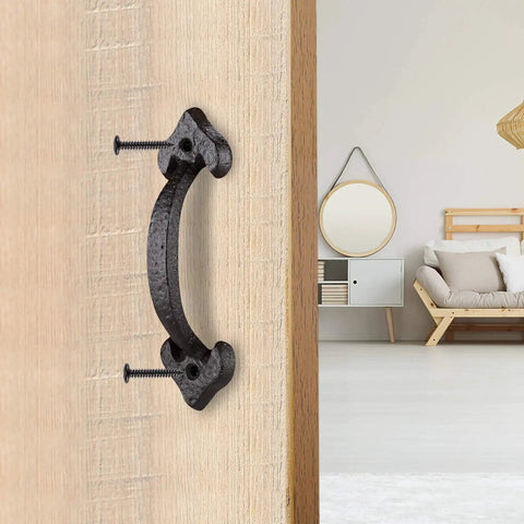 Front view of 7 Inch Heavy Duty Cast Iron Barn Door Handle Medieval Rustic Gate Pull in vintage black on wooden door