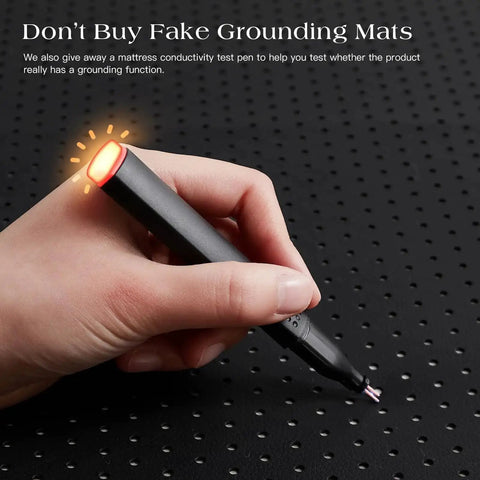Hand testing grounding mat with conductivity pen, part of the Grounding Mat For Bed With Earth Connected Mattress Cover And Grounded Kit Cord Included California King Size Sleep Health Upgrade For Natural Energy And Better Rest At Home