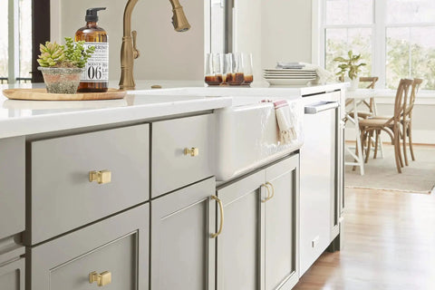 Kitchen with Champagne Bronze Revitalize Cabinet Pull 5-1/16 Inch Center to Center Drawer Pulls on gray cabinetry