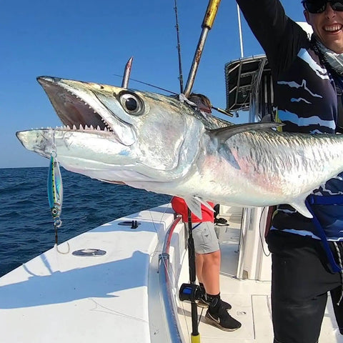 Lead Vertical Saltwater Jig Lures Set Killer Pro Grade with assist hook used to catch large fish on a boat at sea