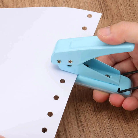 Hand using One Quarter Inch Hole Punch Handheld Heavy Duty Metal Paper Punch for tags, DIY projects, scrapbook, tickets, ergonomic blue grip