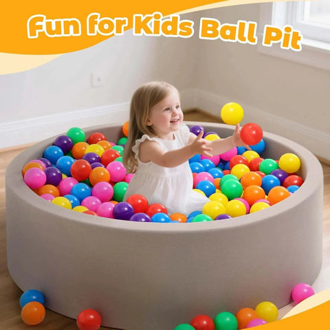 Child playing in a ball pit with Ball Pit Balls for Toddlers: 100 Colorful Non-Toxic Balls – BPA-Free, Phthalate-Free, 2.2 Inches