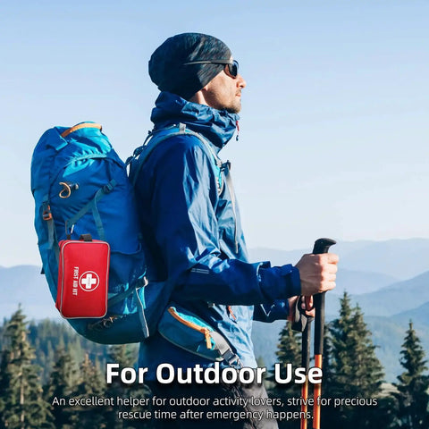 Hiker with backpack in mountain landscape, featuring a 330 Piece First Aid Kit Premium Waterproof Compact Trauma Medical Kit for emergencies.