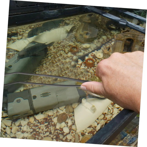 Person using Long Handle Stainless Steel Feeder Tweezers For Deep Water Feeding And Aquarium Plant Care in a fish tank.