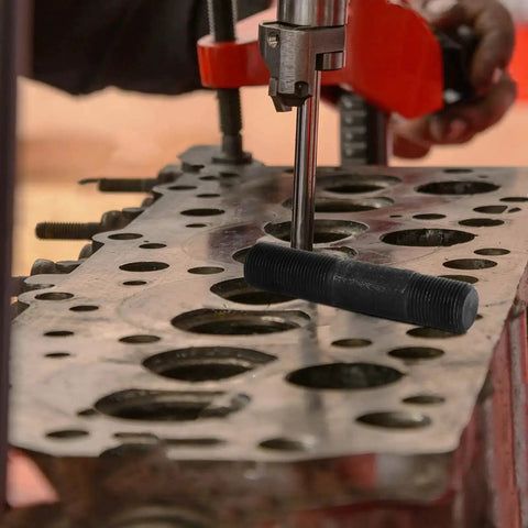 Heavy Duty Hydraulic Punch Driver Kit With Pull Rod Lock Cap in use for metal hole knockout