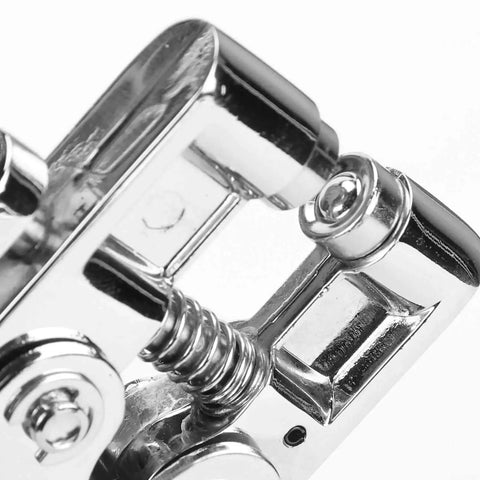 Close-up of Metal Handheld All In One Hole Puncher With Retainer For Office And Home Use Manual Punching Tool showing spring mechanism.