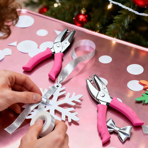 Two Piece Hole Punch Set Circle Punches One Quarter Inch And One Eighth Inch With Pink Soft Grip Handles on pink table with crafts