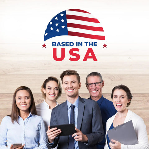 Group of five smiling professionals holding devices with "Based in the USA" sign and American flag above
