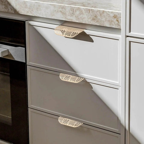 Leaf Shaped Cabinet Pulls 2 Pack Curved Hollow Gold Leaf Drawer Handles In Zinc Alloy with 96mm Hole Spacing on white drawers