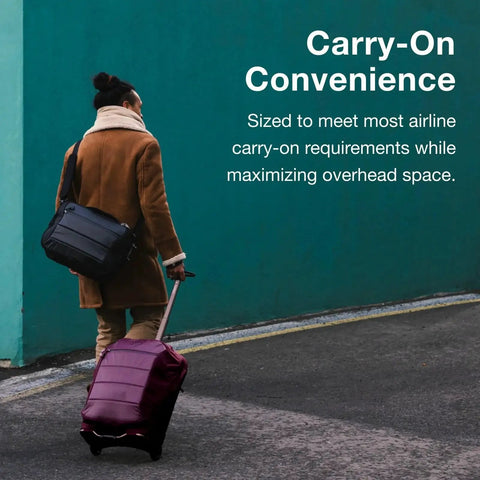 Person using Ozone 2-Wheel Carry-On Luggage With Oversized Wheels And Telescoping Handle From Osprey, against teal wall