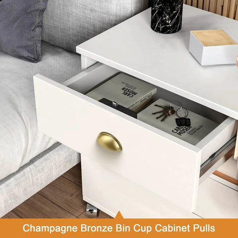 Champagne bronze bin cup cabinet pull on a white drawer, showcasing 5 Pack Champagne Bronze Cabinet Pulls 3 Inch Hole Centers.